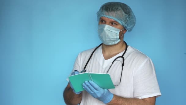 Doctor Stethoscope Writes Notebook Pen Medical Worker Uniform Fills Out — Stock Video