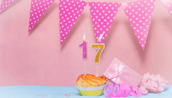 Date of Birth  17. Greeting card in pink shades. Anniversary candle numbers. Happy birthday girl, polka dot garland decoration. Copy space.