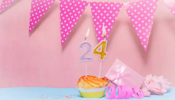 Date of Birth  24. Greeting card in pink shades. Anniversary candle numbers. Happy birthday girl, polka dot garland decoration. Copy space.