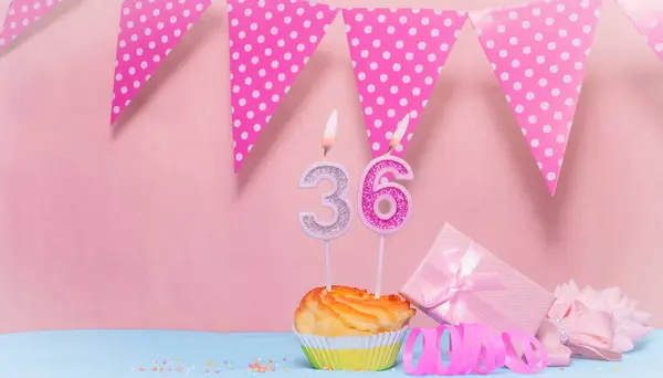 Date of Birth  36. Greeting card in pink shades. Anniversary candle numbers. Happy birthday girl, polka dot garland decoration. Copy space.
