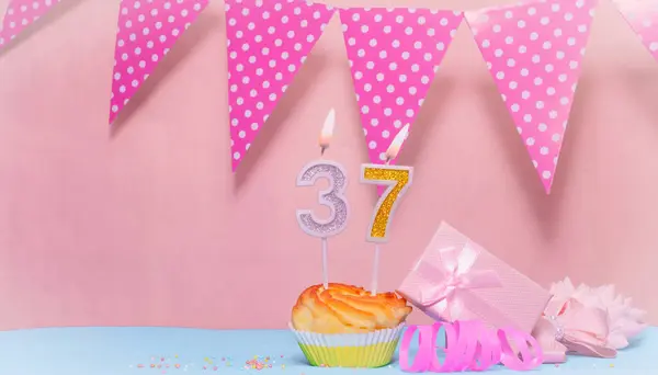 Date of Birth  37. Greeting card in pink shades. Anniversary candle numbers. Happy birthday girl, polka dot garland decoration. Copy space.