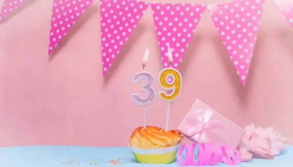 Date of Birth  39. Greeting card in pink shades. Anniversary candle numbers. Happy birthday girl, polka dot garland decoration. Copy space.