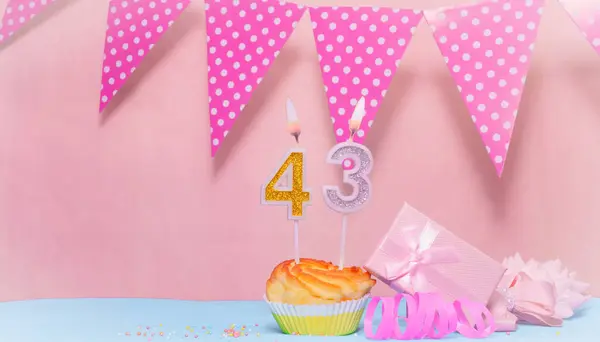 Date of Birth  43. Greeting card in pink shades. Anniversary candle numbers. Happy birthday girl, polka dot garland decoration. Copy space.