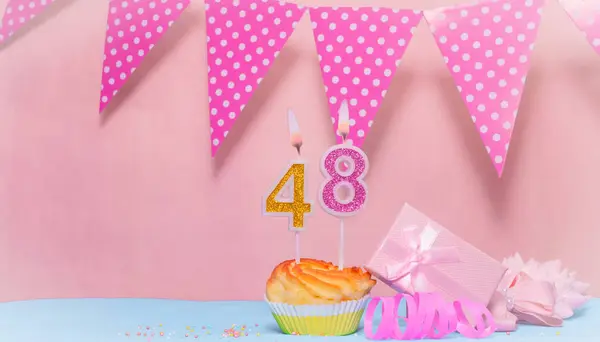 Date of Birth  48. Greeting card in pink shades. Anniversary candle numbers. Happy birthday girl, polka dot garland decoration. Copy space.