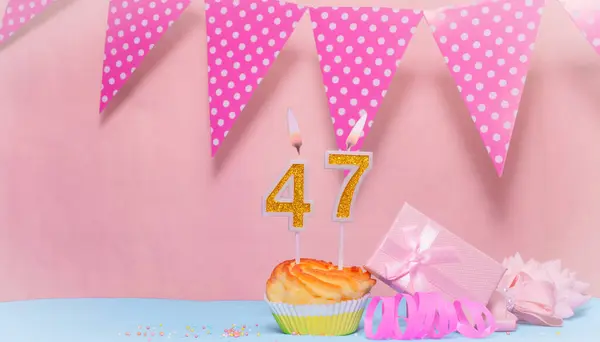 Date of Birth  47. Greeting card in pink shades. Anniversary candle numbers. Happy birthday girl, polka dot garland decoration. Copy space.