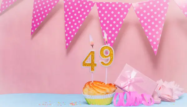 Date of Birth  49. Greeting card in pink shades. Anniversary candle numbers. Happy birthday girl, polka dot garland decoration. Copy space.