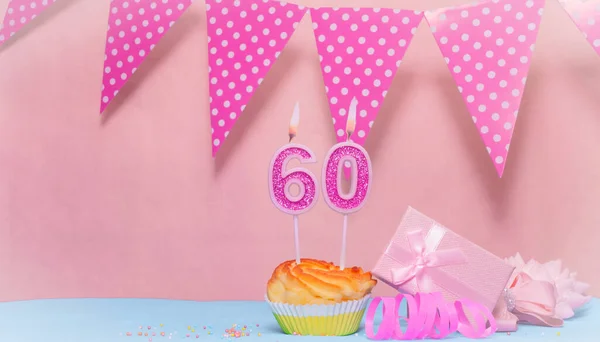 Date of Birth  60. Greeting card in pink shades. Anniversary candle numbers. Happy birthday girl, polka dot garland decoration. Copy space.