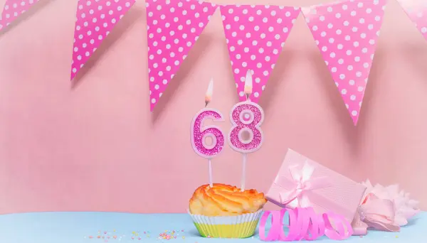 Date of Birth  68. Greeting card in pink shades. Anniversary candle numbers. Happy birthday girl, polka dot garland decoration. Copy space.