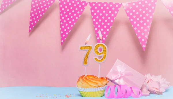 Date of Birth  79. Greeting card in pink shades. Anniversary candle numbers. Happy birthday girl, polka dot garland decoration. Copy space.