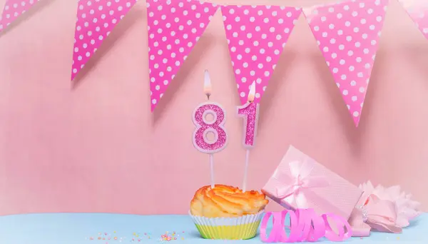 Date of Birth  81. Greeting card in pink shades. Anniversary candle numbers. Happy birthday girl, polka dot garland decoration. Copy space.
