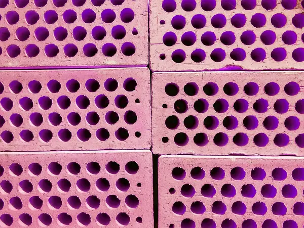 Neon purple brick wall. Copy space background. Creative brick background. Creative brick texture