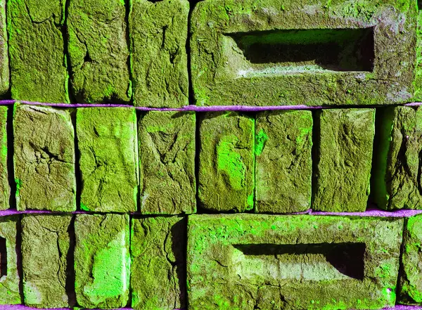Neon green brick wall. Copy space background. Creative brick background. Creative brick texture