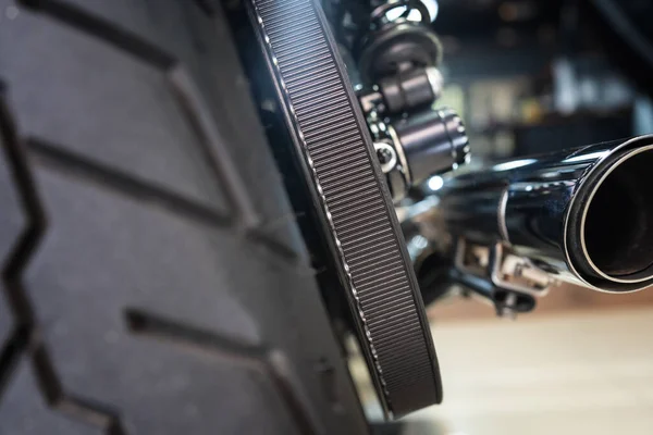 Motorcycle rear belt drive at garage, belt drive reduces maintenance and quieter than chains. maintenance,repair motorcycle concept,selective focus