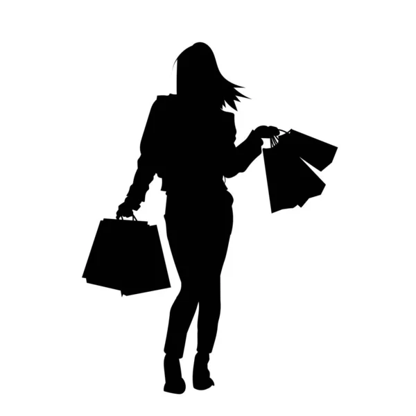 一个身材苗条的年轻女子拿着购物袋的轮廓 时尚女性购物者的轮廓 — 图库矢量图片