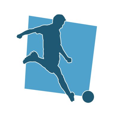 Top tekmeleyen bir erkek futbolcunun silueti. Hareket halindeki bir futbolcunun silueti.
