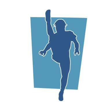 Dövüş sanatları pozu veren bir erkeğin silueti. Dövüş sanatları ustasının silueti tekme atma pozu veriyor..