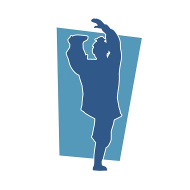 Doğu dövüş sanatı pozu veren bir adamın silueti. Dövüş sanatlarında bir erkeğin silueti..