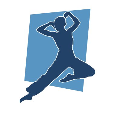 Poz vermiş bir balerin kadın silueti. Hareket halindeki bir balerin silueti..