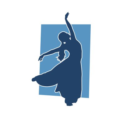 Poz vermiş bir balerin kadın silueti. Hareket halindeki bir balerin silueti..