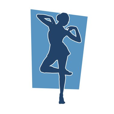 Poz vermiş bir balerin kadın silueti. Hareket halindeki bir balerin silueti..