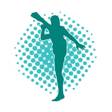 Dövüş sanatları pozu veren bir erkeğin silueti. Dövüş sanatları ustasının silueti tekme atma pozu veriyor..