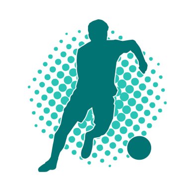 Top tekmeleyen bir erkek futbolcunun silueti. Hareket halindeki bir futbolcunun silueti.