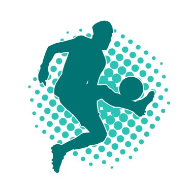 Top tekmeleyen bir erkek futbolcunun silueti. Hareket halindeki bir futbolcunun silueti.