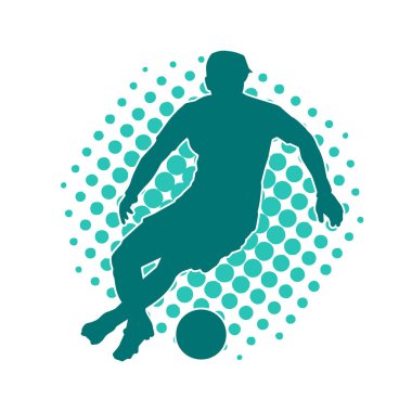 Top tekmeleyen bir erkek futbolcunun silueti. Hareket halindeki bir futbolcunun silueti.