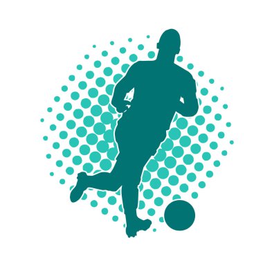 Top tekmeleyen bir erkek futbolcunun silueti. Hareket halindeki bir futbolcunun silueti.