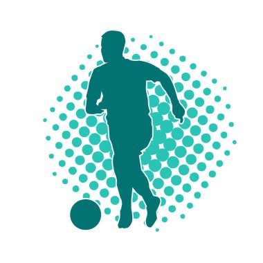 Top tekmeleyen bir erkek futbolcunun silueti. Hareket halindeki bir futbolcunun silueti.