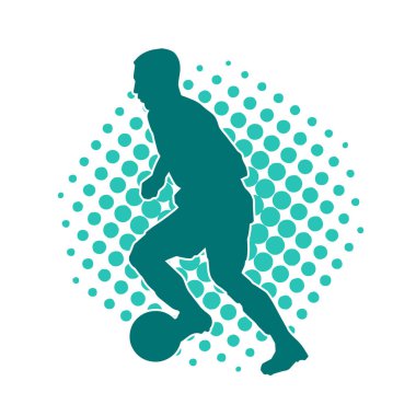 Top tekmeleyen bir erkek futbolcunun silueti. Hareket halindeki bir futbolcunun silueti.