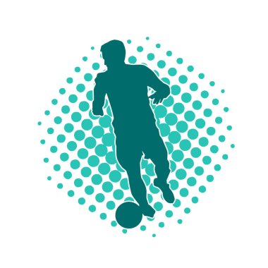 Top tekmeleyen bir erkek futbolcunun silueti. Hareket halindeki bir futbolcunun silueti.