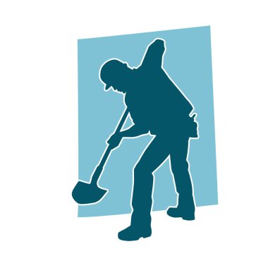 Kürek taşıyan bir işçinin silüeti. Bir işçinin hareket halindeki silueti kürek aracı kullanarak poz verir.