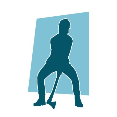 Hareket halindeki bir işçinin silueti, baltasını kullanarak poz verir..