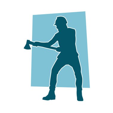 Hareket halindeki bir işçinin silueti, baltasını kullanarak poz verir..