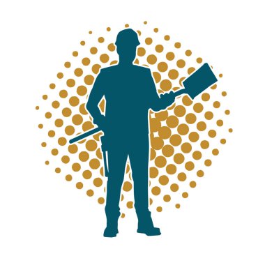 Kürek taşıyan bir işçinin silüeti. Bir işçinin hareket halindeki silueti kürek aracı kullanarak poz verir.