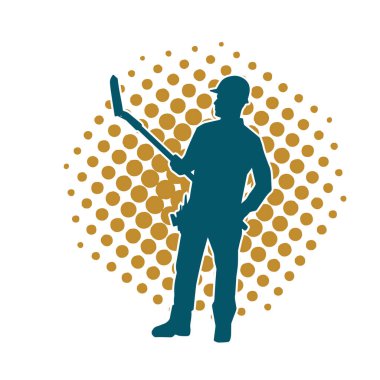 Kürek taşıyan bir işçinin silüeti. Bir işçinin hareket halindeki silueti kürek aracı kullanarak poz verir.