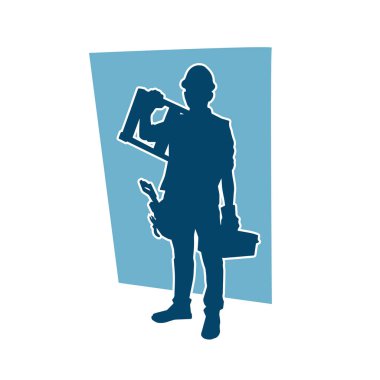 İnşaat işçisi kostümlü bir adamın silueti. İnşaat işçisinin silueti pozda.. 