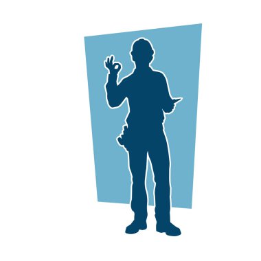 İnşaat işçisi kostümlü bir adamın silueti. İnşaat işçisinin silueti pozda.. 