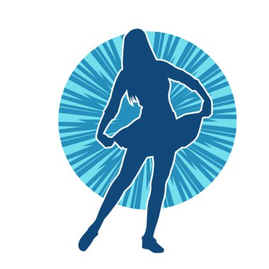 Hareketli pozlarda mini etek giyen bir kadın dansçının silueti. Zayıf bir kadının silueti mutlu bir şekilde dans ediyor..