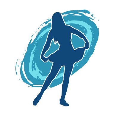 Hareketli pozlarda mini etek giyen bir kadın dansçının silueti. Zayıf bir kadının silueti mutlu bir şekilde dans ediyor..