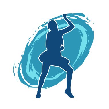 Hareketli pozlarda mini etek giyen bir kadın dansçının silueti. Zayıf bir kadının silueti mutlu bir şekilde dans ediyor..