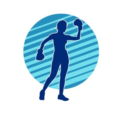 Kadın boks oyuncusunun silueti. Boks yaparken boks eldiveni giyen bir kadının silueti..