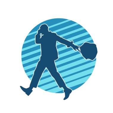 Evrak çantası taşıyan bir iş adamının silüeti.