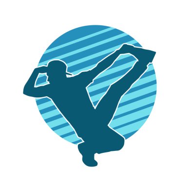 Hareket halindeki bir erkek dansçının silueti. Dans eden zayıf bir adamın silueti..