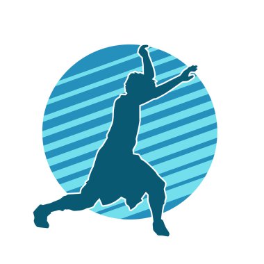 Hareket halindeki bir erkek dansçının silueti. Dans eden zayıf bir adamın silueti..