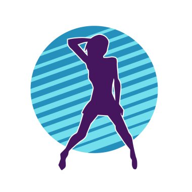 Hareketli pozlarda mini etek giyen bir kadın dansçının silueti. Zayıf bir kadının silueti mutlu bir şekilde dans ediyor..