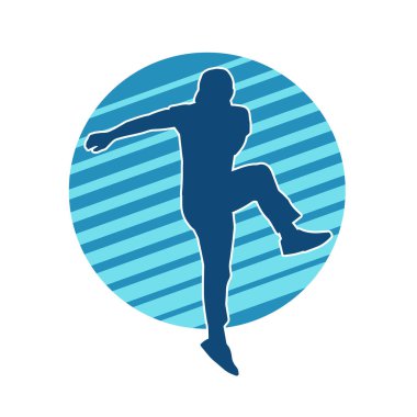 Hareket halindeki bir erkek dansçının silueti. Dans eden zayıf bir adamın silueti..