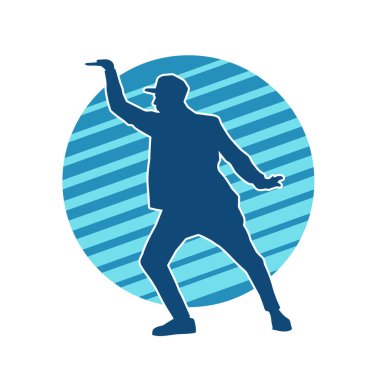 Hareket halindeki bir erkek dansçının silueti. Dans eden zayıf bir adamın silueti..