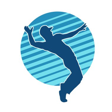 Hareket halindeki bir erkek dansçının silueti. Dans eden zayıf bir adamın silueti..